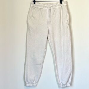 No Boundaries Off White Jogger Pants with Subtle Butterfly Design - Medium